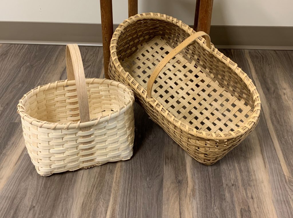 To handwoven baskets made by Sarah King