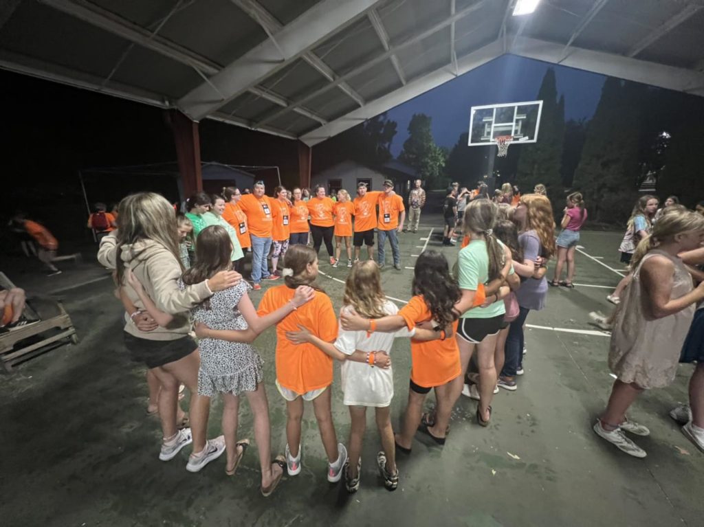 Large group of students in a circle at 4-H Camp