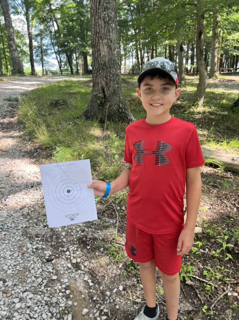Child holding up used target