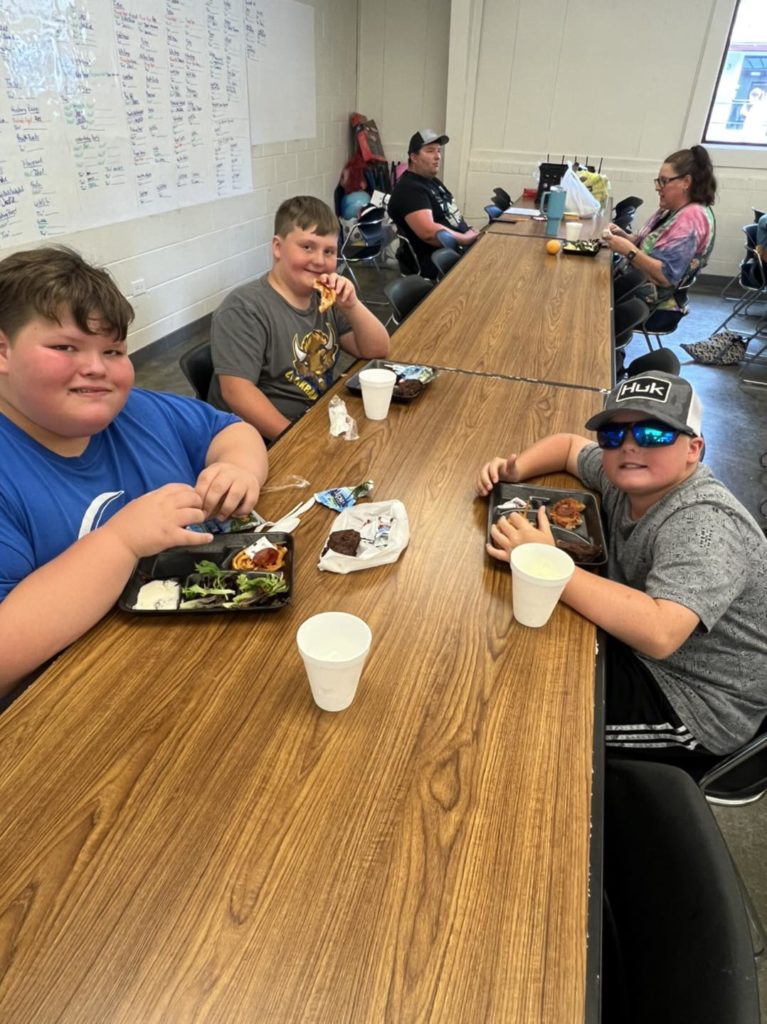 Students at the Table enjoying a meal at 4-H Camp